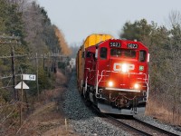 After meeting two eastbounds at Puslinch, 241 once again is on the move to Wolverton behind a new SD30C-ECO. Some spotting differences between the earlier and later versions is the relocation of the ditchlights from below the anticlimber to above it and the retention of the two air train lines that were a standard CPR feature on most of the GP9u's, GP38-2's, SD40-2's, SD40-2F's and AC4400's. 