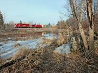 It's a slow climb up Campbellville Hill and both units are nearing the top of the grade with 110 cars on the drawbar. Seen here, the sun makes an appearance on this rather warm Sunday afternoon as the head end passes by capturing a broadside of two somewhat clean units.    