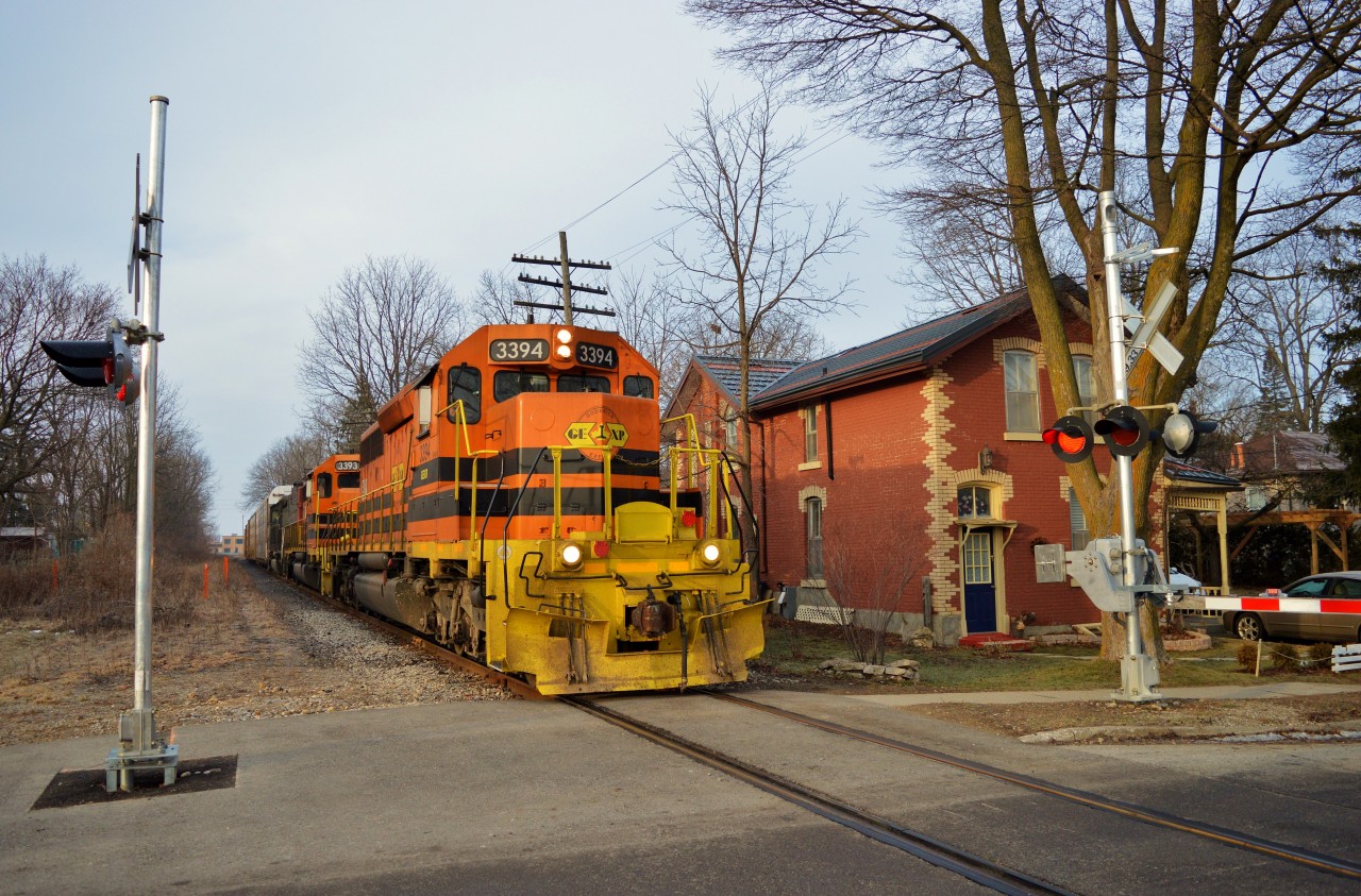 Taken with my new DSLR!432-07 crosses Yorkshire St. in Guelph with 36 cars. Today's consist was auto-racks from Toyota in Cambridge, picked up at Kitchener, some gondolas loaded at Gerdeau in Guelph, picked up at Kitchener, and Potash cars from Agrium at Kelly's, near mile 106 Guelph Sub.I didn't know it, but I had just missed a GO test train. Metrolinx has wanted to add 2 GO extra GO trains each way on the Kitchener line. The train apparently departed Georgetown westbound at 0700h, and departed Kitchener at 0800h for the return to Georgetown.To see more photos, please visit: https://www.flickr.com/photos/132395721@N08/