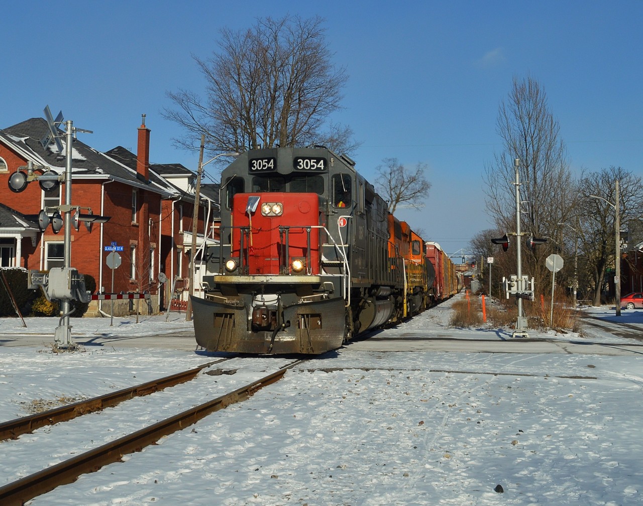 431-13 rolls slowly west at Glasgow Street in Guelph with 38 cars on a bitterly cold day with temps at -25°C!  A number of the trucks on the cars were encased in ice.