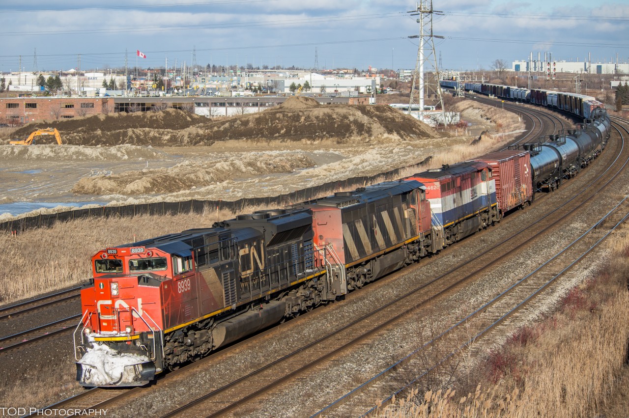 CN 369 stops at the Oshawa VIA Station due to a problem with an axle on one of the cars. After some inspection, 369 is finally on the move and told to continue its trip to Mac yard with a 25mph speed restriction.