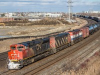 CN 369 stops at the Oshawa VIA Station due to a problem with an axle on one of the cars. After some inspection, 369 is finally on the move and told to continue its trip to Mac yard with a 25mph speed restriction.

