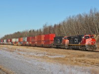 Dash 9-44CW CN 2566 and SD75I CN 5790 head east past North Cooking Lake.