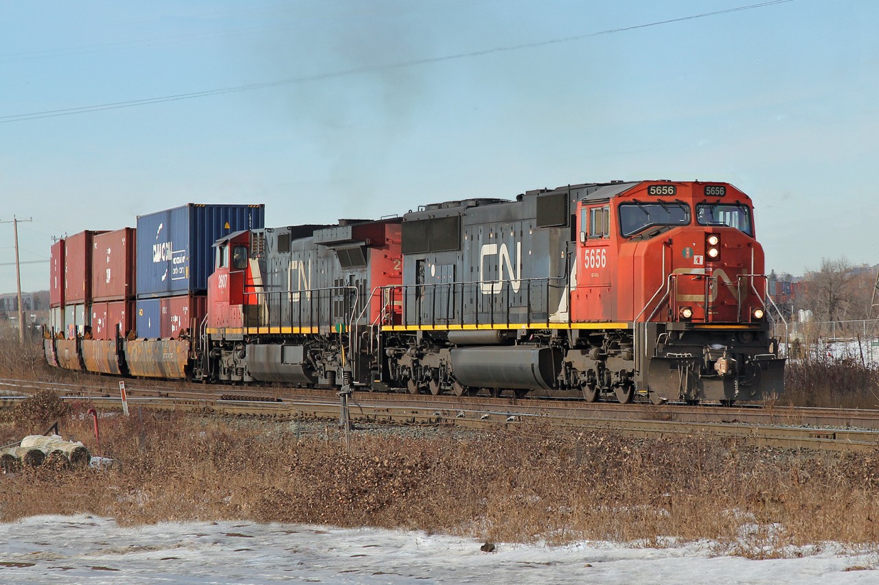Having just crossed the North Saskatchewan River SD75I CN 5656 and Dash 9-44CW CN 2607 pass Bretville Junction with an eastbound intermodal.