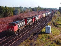 This image was shot from the Waterdown Rd bridge, looking east; in 1989. In view is CN 9449, 9572 and 2112 with train #393. I posted this for a couple of reasons. One being to show the lush green stand of trees in the background; a piece of rural countryside within the City of Burlington. And secondly, in case someone out there wants to match this location with a current image to show for TIME MACHINE. This is an easy opportunity. For behind the motive power, that beautiful stand of trees was leveled for the Aldershot GO station. Those of you out there that believe man is responsible for global warming; why look farther than here? Coolness of the woods exchanged for a hot asphalt parking lot.