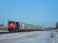 CN 2850 (ES44AC) leads a mixed freight heading west out of Winnipeg.
