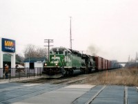 NS train #328 heading from St. Thomas (Talbotville) to Buffalo, autoparts, daily, always had a surprise in its' power consist. Or so it seemed. Here's one of my favourite schemes, that white & green faced BNSF leading a NS 6693 as it roars past the town VIA kiosk. Considerable expense went into setting up the new kiosk and a fancy sign; and of course what does VIA do? Cancel all operations down Niagara-way. Worse, the #328 is now history too. Getting quiet in ol' Grimsby-town. :o(