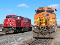 BNSF Dash9-44CW poses with CP SD60M as it waits it's turn to head west towards the service island.