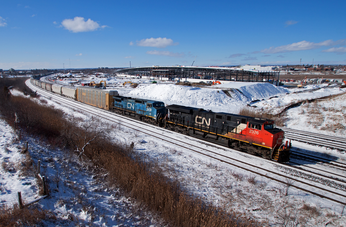 2236, IC 2459 and 2653(DPU) haul the daily Toronto-Moncton manifest past the growing construction GO Transit's new maintenance facility. It won't be long before this location is history; South Blair St. is nearly completed and construction has started on the east side of Hopkins St.