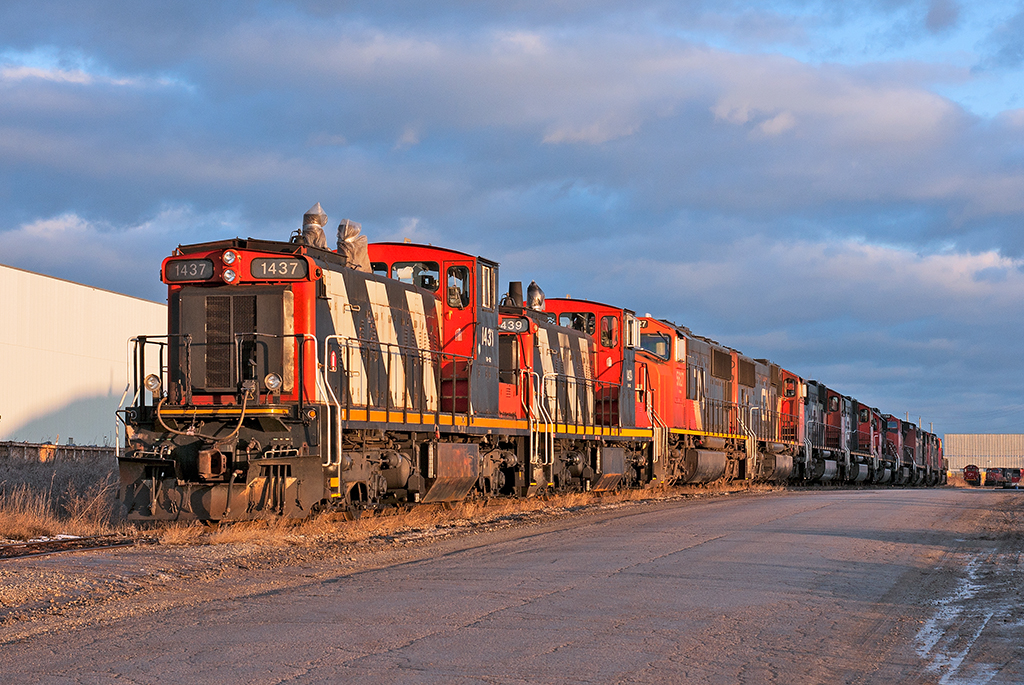 CN 1437 and sister 1439 sit stored with various amounts of mainline power from SD60's to SD70/75i's. CN 1412 and CN 1444  sit out of view also stored as well.