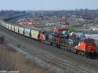 CN unit potash train number 730 curves through Whitby, Ontario, behind CN 2921 and 2809, with 3005 bringing up the rear. I don't know the exact tonnage or length of this monster, but it consisted of 151 loaded potash hoppers, which is not excessively long around these parts, but being in the 20,000 ton range would certainly qualify it as one of the heavier trains. 1329hrs.