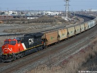 CN 3005 brings up th markers on the rear of train 730, 151 potash loads and three units. Am pleased to have caught one of these monsters at the old Lasco bridge in the few remaining weeks before it is closed for good. 1331hrs.