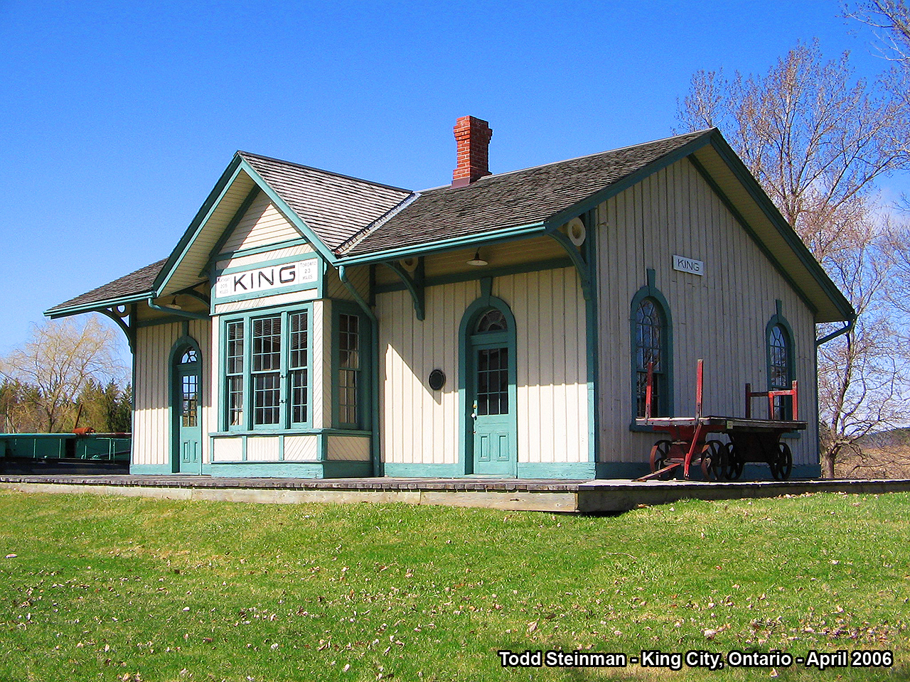 After A.W. Mooney posted his 1976 photo of the Newmarket station - I had planned to also post my 2006 shot. However, since Terry O'Shell beat me to the punch with his great shot of the Newmarket station today, I decided to post one of another station from the same subdivision.

The King Station is one of Ontario's oldest railway stations. Now relocated to the museum grounds just outside of King City, it basks in the early spring sunlight of April 2006. Still looks good after 100 + years.