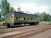This unusual car, CN 15006, was photographed on July 12, 1954 in Cochrane, Ontario where it was being used as an Instruction Car. It was built about 1912 by the Louisville & Nashville Railroad as a steam-powered, coal-fired self propelled passenger car. A few years later it was acquired by the Grand Trunk and numbered 3 but how the GT used it is unknown. It was off the CN roster by 1961.
