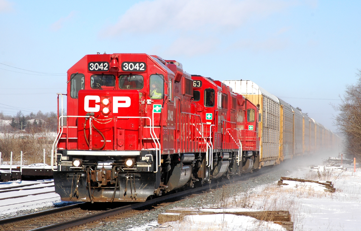 CP 3033, CP 2263 and CP 3033 charge West towards Wolverton with 39 autoracks from Toyota in Cambridge