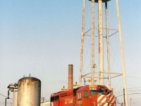Built in 1984 this SD40-2 waits on track 1 east of the Diesel Shop. The water tower, powerhouse chimney and sand tanks are all gone now.