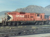 Typical warm sunny day in Kamloops BC. When I was in or passing by Kamloops I always tried to visit the west end of the CP yards. Nice concrete platform to walk on, & lots of action. On this day CP GP-9 8636 was catching a little sun. The paint job looked a little faded, but that was normal for British Columbia based CP GP-9's in 1987. 