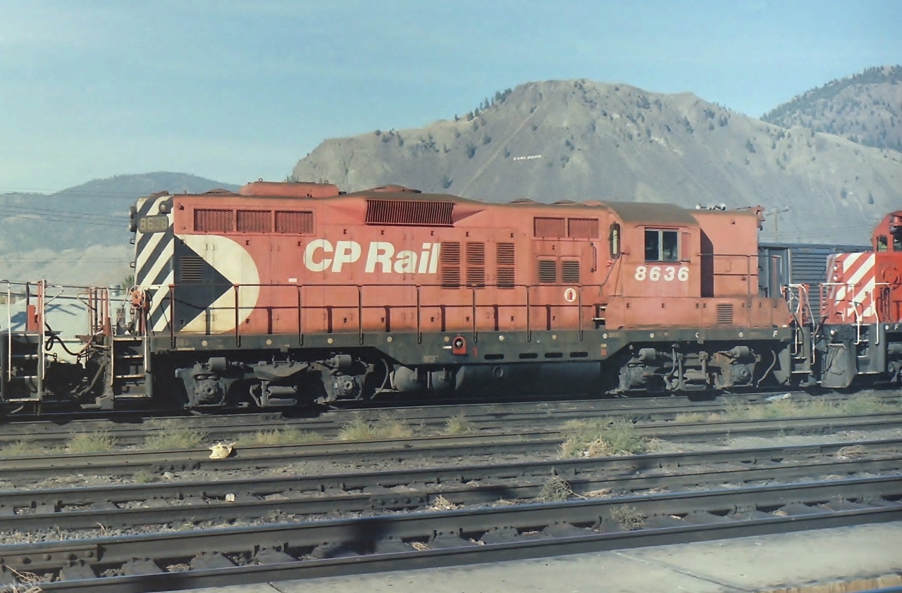 Typical warm sunny day in Kamloops BC. When I was in or passing by Kamloops I always tried to visit the west end of the CP yards. Nice concrete platform to walk on, & lots of action. On this day CP GP-9 8636 was catching a little sun. The paint job looked a little faded, but that was normal for British Columbia based CP GP-9's in 1987.