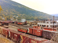 This picture was taken on my first trip to Nelson BC in Oct 1981. For a fall day, the weather was great! This picture was taken from the side of highway which sits at a slightly higher elevation then the CP yards. Lots of activity going on. Never saw an FM unit, but did catch a "B" unit near the newer locomotive shops. The picture has a lot of lost history in it. 