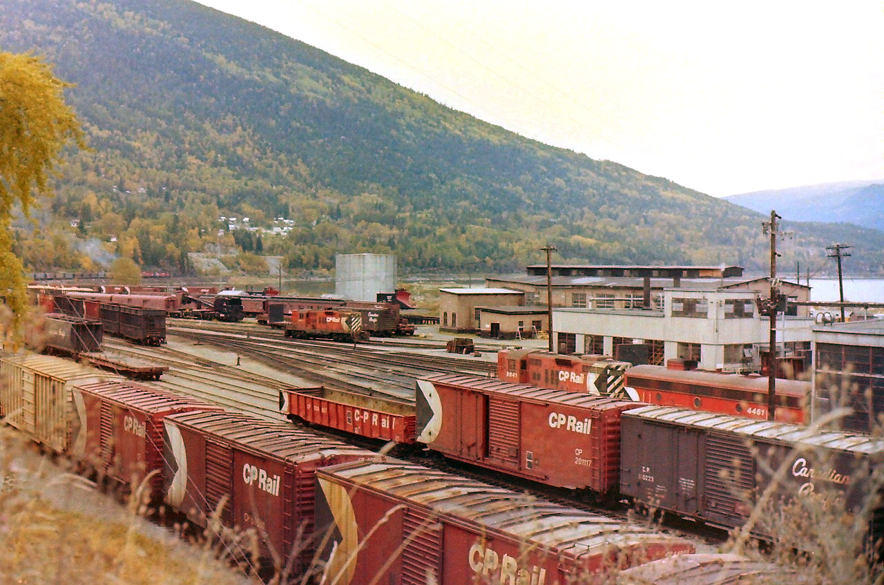 This picture was taken on my first trip to Nelson BC in Oct 1981. For a fall day, the weather was great! This picture was taken from the side of highway which sits at a slightly higher elevation then the CP yards. Lots of activity going on. Never saw an FM unit, but did catch a "B" unit near the newer locomotive shops. The picture has a lot of lost history in it.