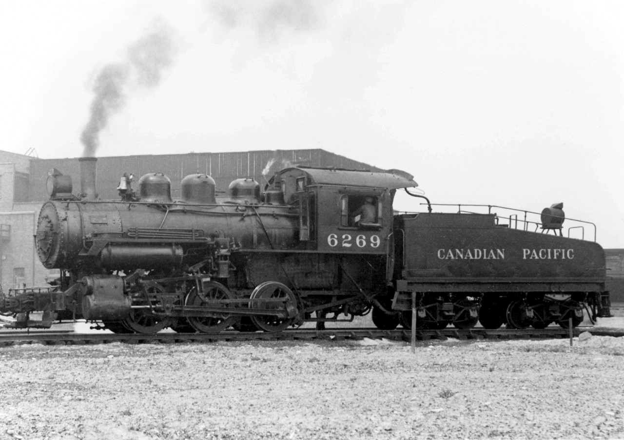 Canadian Pacific U3e 0-6-0 6269 (built by CPR's Angus Shops in 1912) has just arrived at CN's Mimico Yard to switch CPR customers in New Toronto, working the Swansea Transfer job in 1954. The little 0-6-0's, with no leading or trailing trucks, were ideal for use as yard switching and transfer locomotives as all the weight was on the drivers.

Omer Lavallee's "Canadian Pacific Steam Locomotives" says this locomotive was later converted to Shop Tool SL-6 in 1956.

For more on the CP's Swansea Transfer and the customers it served, see Ray Kennedy's page on Swansea at Old Time Trains.