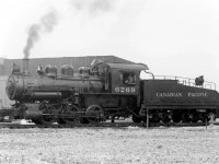 Canadian Pacific U3e 0-6-0 6269 (built by CPR's Angus Shops in 1912) has just arrived at CN's Mimico Yard to switch CPR customers in New Toronto, working the Swansea Transfer job in 1954. The little 0-6-0's, with no leading or trailing trucks, were ideal for use as yard switching and transfer locomotives as all the weight was on the drivers.<br><br>Omer Lavallee's "Canadian Pacific Steam Locomotives" says this locomotive was later converted to Shop Tool SL-6 in 1956.<br><br>For more on the CP's Swansea Transfer and the customers it served, see Ray Kennedy's page on Swansea at <a href=http://www.trainweb.org/oldtimetrains/CPR_Toronto/SWANSEA_OFT.htm><b>Old Time Trains</b></a>.