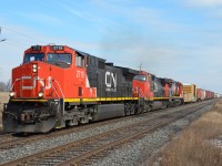 A rather early CN A435 heads West past mile 20 of the CN Halton Sub during the only sunny break of the day. Due to the early arrival of CN A422 at 12:57pm through mile 20, I suspect the 435 was able to leave Mac yard because of an unoccupied Aldershot yard. IC 2719 is a nice and clean surprise compared to most CN dash 9s.