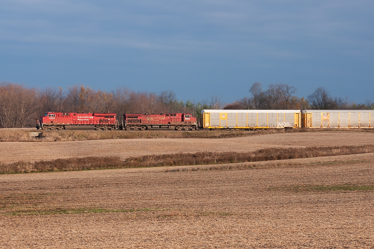 Another westbound rumbles along behind 2 GE's