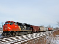 <b>Shoving on a monster grain train.</b> CN 8894 shoves on 136 loaded grain cars as a very lengthy CN 874 makes its way through Dorval. Up front are CN 2318 & IC 1028.