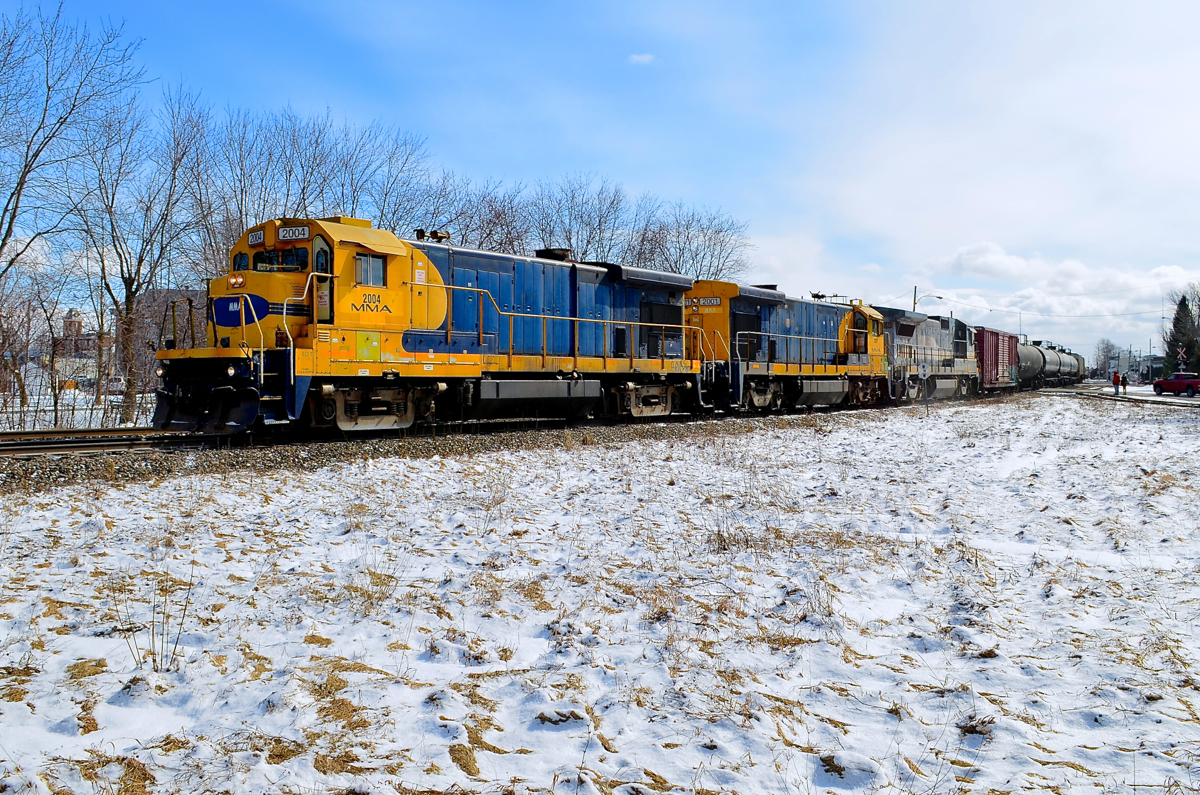 The MMA leaving Farnham. An MMA local for St-Jean has two B23-7's and a B39-8E (MMA 2004, MMA 2001 & MMA 8546) as it leaves Farnham in March 2013, a few months before the Lac-Mégantic disaster made the MMA an infamous name.