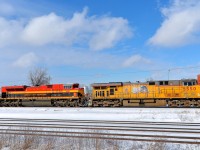<b>The UP/KCS duo, back in Montreal for a third time.</b> For the third time in under two weeks, the colourful duo of UP 5550 and KCS 4166 led CP 142 into Montreal. Here it passes through Dorval on a very bright and sunny afternoon. This power should leave Montreal tomorrow afternoon on CP 143, as it has the previous two times.