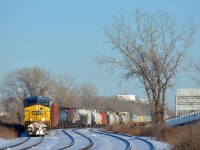 <b>Negotiating the s-curve at Dorval.</b> CN 327 is through the s-curve Dorval on a gorgeous afternoon with a pair of CSXT AC4400CW's (CSXT 531 & CSXT 106) along with GP9 CN 4102. 