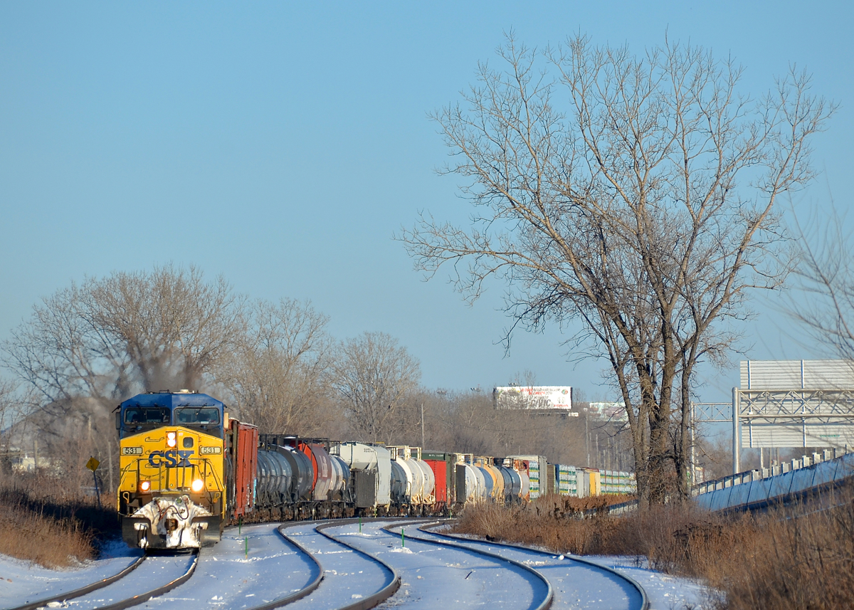 Negotiating the s-curve at Dorval. CN 327 is through the s-curve Dorval on a gorgeous afternoon with a pair of CSXT AC4400CW's (CSXT 531 & CSXT 106) along with GP9 CN 4102.