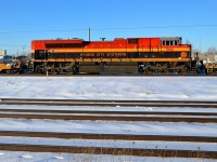 Colourful SD70ACe KCS 4166 is the DPU on CP 143, westbound through Dorval on a sunny afternoon, with UP 5550 at the head end.