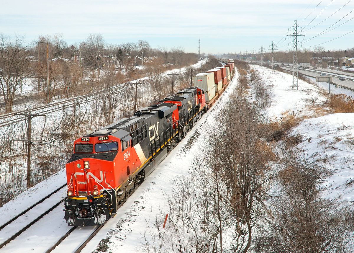 Intermodal hot shot. Hot shot Montreal-Chicago intermodal train CN 149 blasts through Beaconsfield with ES44AC's CN 2924 & 2889 as power.