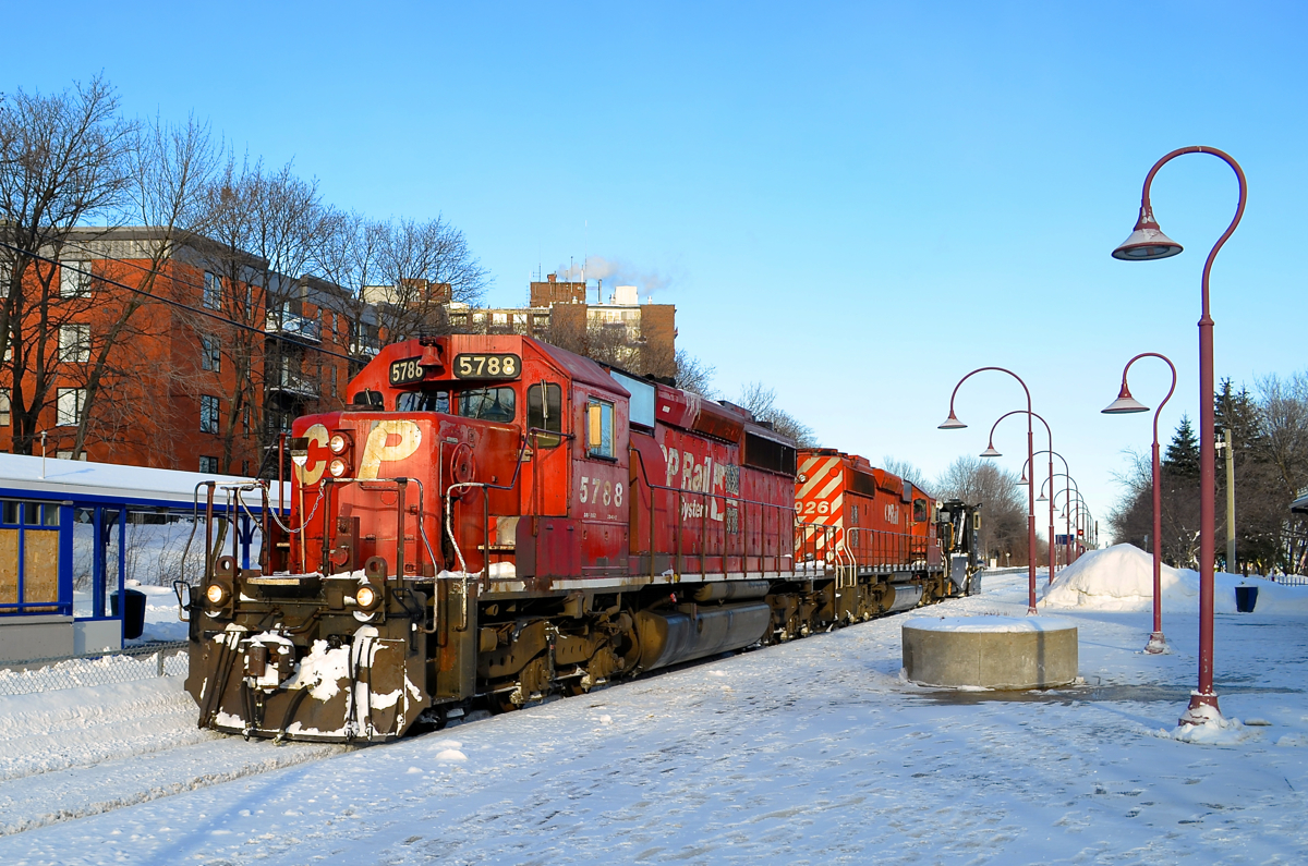 Two SD40-2's and a spreader. A pair of CP SD40-2's (CP 5788 & CP 5926) along with spreader CP 402893 are stopped in front of Montreal West station after clearing the Westmount sub. This was a week after after a record-breaking storm dumped about 45 cm of snow on the island of Montreal.
