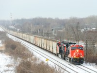 <b>A new potash train in Eastern Canada.</b> Running for the first time, CN B730 has 153 potash loads from Yarbo, Saskatchewan destined for Saint John, New Brunswick as it heads east through Beaconsfield. Power is a trio of GEVO's, with ET44AC CN 3032 leading ES44AC's CN 2925 trailing and CN 2879 at the end of the train.