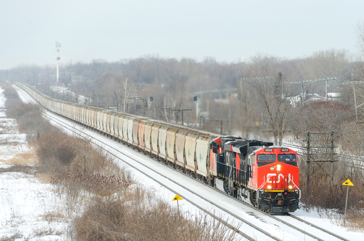 A new potash train in Eastern Canada. Running for the first time, CN B730 has 153 potash loads from Yarbo, Saskatchewan destined for Saint John, New Brunswick as it heads east through Beaconsfield. Power is a trio of GEVO's, with ET44AC CN 3032 leading ES44AC's CN 2925 trailing and CN 2879 at the end of the train.