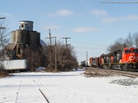CN 3028 leads train X332 through Copetown Ontario and past the old feedmill on a sunny January morning.