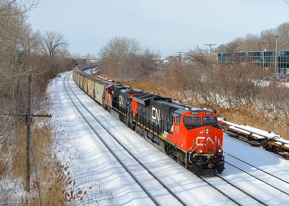 Potash train approaching a crew change. Running for the first time, CN B730 has 153 potash loads from Yarbo, Saskatchewan destined for Saint John, New Brunswick as it slowly approaches Turcot West where it will get a new crew to bring it to Joffre Yard. Power is a trio of GEVO's, with ET44AC CN 3032 leading ES44AC's CN 2925 trailing and CN 2879 at the end of the train.