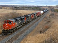 <b>Triple SD70M-2's.</b> A trio of SD70M-2's (CN 8954, CN 8870 & CN 8016) negotiate the s-curve at Newtonville on an overcast day. Operating mid-train is CN 2693. 