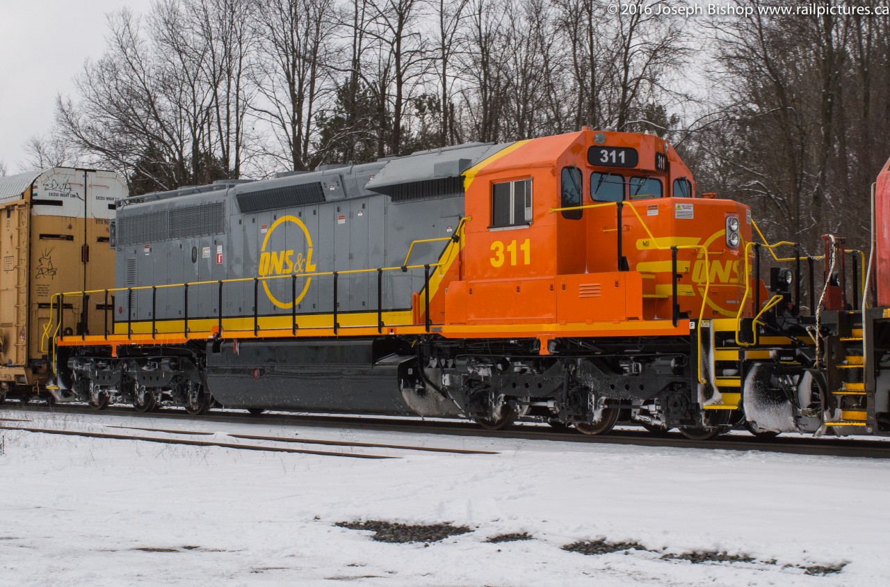 QNSL 311 hitches a ride on CN 148 through Copetown this afternoon.  It is returning from the US after getting rebuilt.