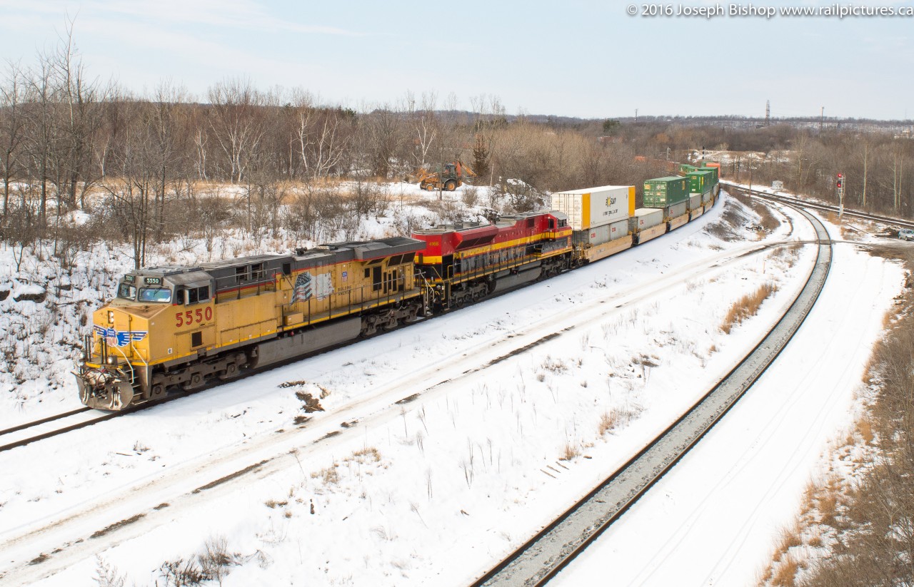 CP 143 slowly curves its way into Hamilton behind UP 5550 and KCS 4166.  I came very close to missing them here having woken up a little after 10 this morning...I had a couple emails on my phone indicating that 143 was on its way.  Originally I had intended on going out to Waterdown for the train but Steve told me to get to Hamilton instead to be safe.  I actually went over their head end on Plains Road after getting off Highway 6 leaving me less than a minute to get in place and get my shot.