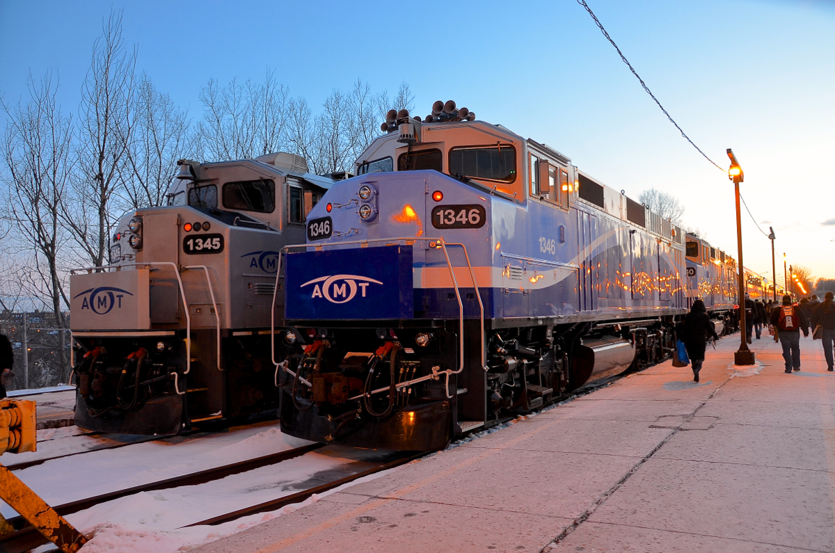 Ex-GO Transit F59PH's AMT 1345 & AMT 1346 both have their marker lights lit a bit after sunset in downtown Montreal. AMT 1345 still has its lights as delivered, whereas AMT 1346 was rebuilt recently and is now sporting just a single light. Behind 1346 is another rebuild, AMT 1340.