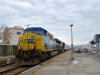 Heading west on the south track (very unusual for this train), CN 327 passes the entrance to the VIA Dorval Station with CSXT 482 & CSXT 5486 for power.