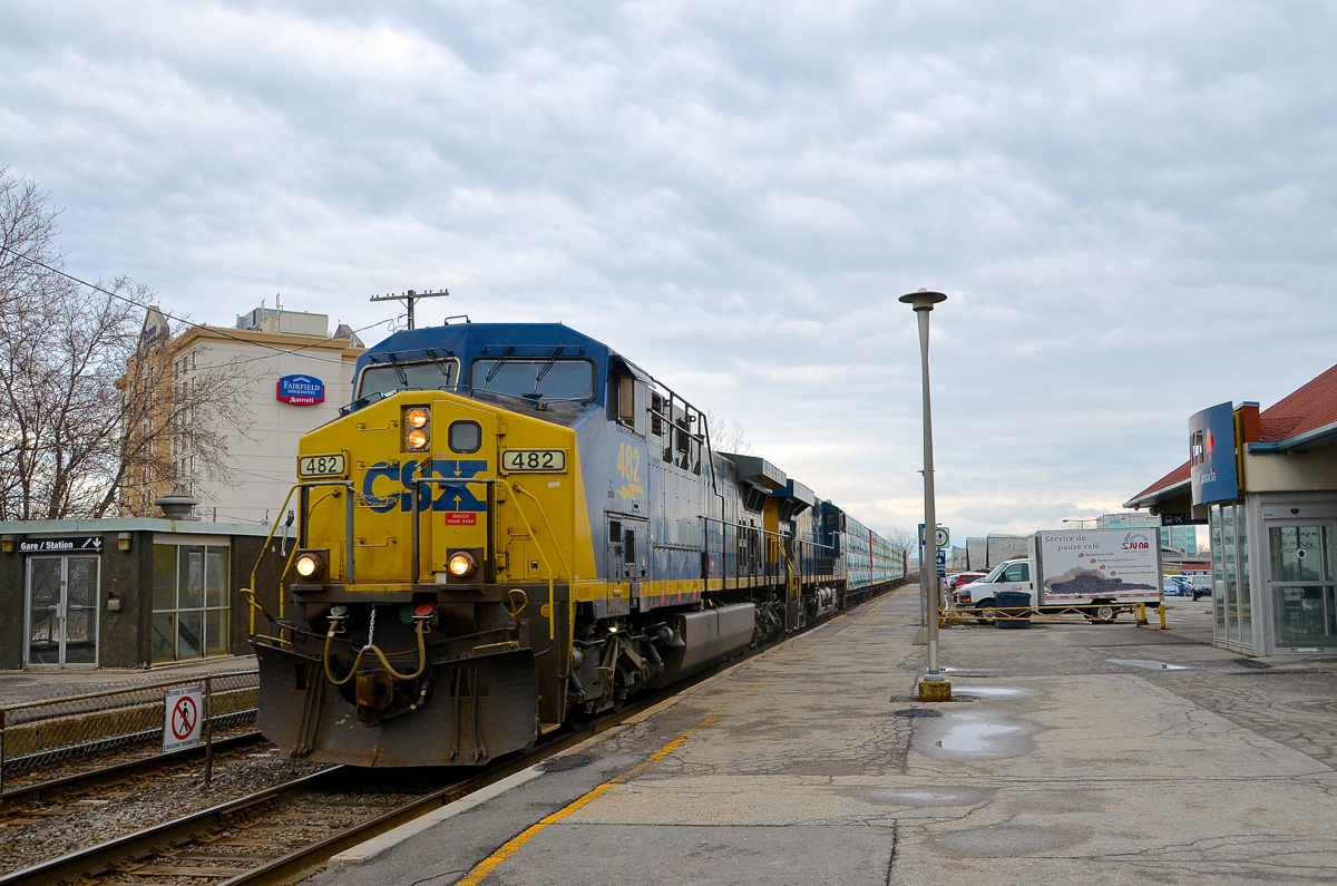 Heading west on the south track (very unusual for this train), CN 327 passes the entrance to the VIA Dorval Station with CSXT 482 & CSXT 5486 for power.