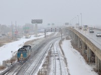<b>Underneath the highway.</b> VIA 62 has just passed underneath an elevated portion of highway 20 as it heads towards its final destination of Central Station in downtown Montreal.