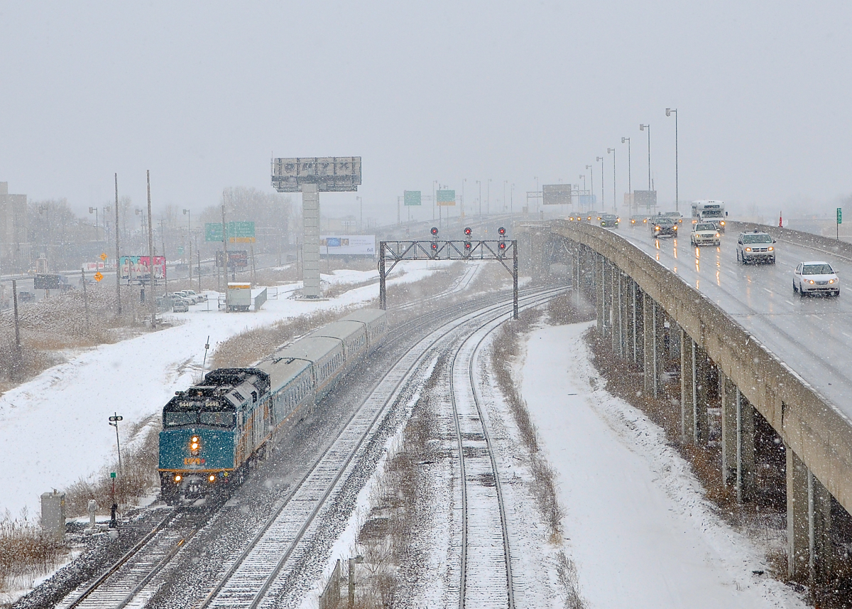 Underneath the highway. VIA 62 has just passed underneath an elevated portion of highway 20 as it heads towards its final destination of Central Station in downtown Montreal.
