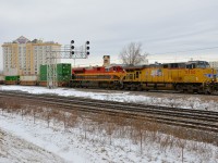 Two years to the day after shooting my first KCS unit (KCS 4012 on CP 119 at Dorval) I was lucky to shoot another one trailing on CP 142 at nearly the same spot. UP 5550 and KCS 4166 provide some colour on a dull afternoon as they lead CP 142 towards St-Luc Yard.