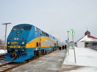 <b>A beat up P42 nose.</b> VIA 911 has one of the most beat up noses of any of the P42DC's on VIA Rail's roster. Here it leads VIA 55, boarding passengers at Dorval Station during a brief period of sunlight on a brutally cold and windy day.
